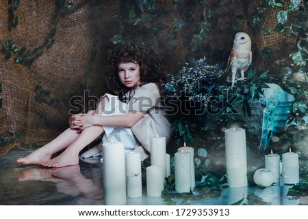 girl in a fairy boat with an owl