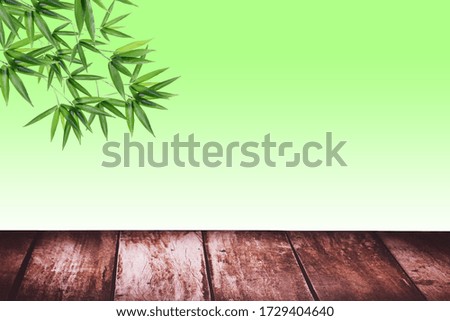 Empty table for display montages  with bamboo leaves