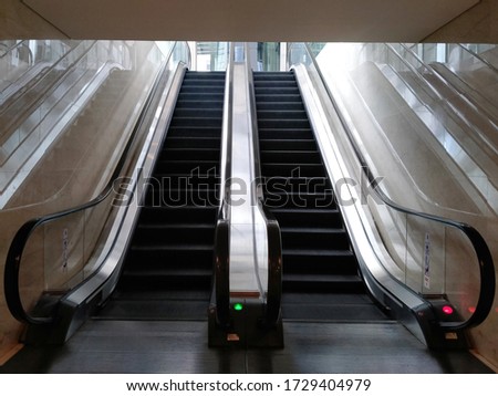 WTC II, Sudirman, Jakarta, Indonesia - April 28, 2020 : An escalator ladder in a quiet office area during a virus pandemic