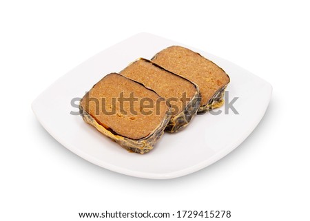 Vegetarian salted fish (haam yu) in dish isolated on white background. Vegan food. Vegetarian food with clipping path
