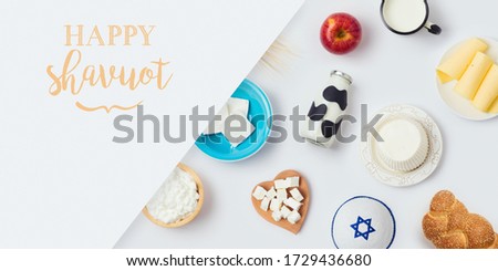 Jewish holiday Shavuot banner design with milk bottle, cheese and bread on white background. Top view from above Royalty-Free Stock Photo #1729436680