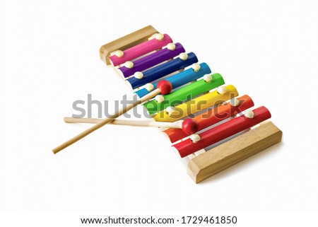 Rainbow Colored Wooden Toy 8 tone Xylophone glockenspiel isolated on white background. toy glockenspiel. Music, vibrant. Rhythm, listen Royalty-Free Stock Photo #1729461850