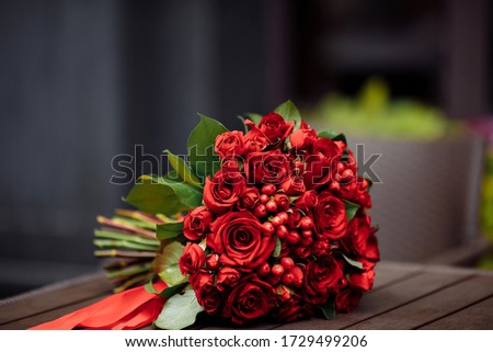 bright red wedding bouquet with roses 