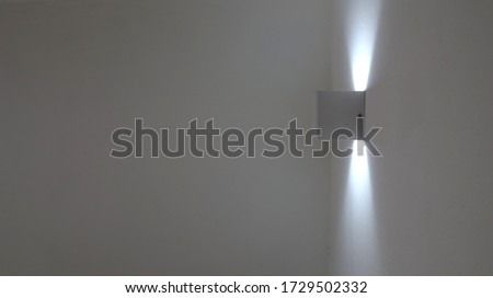 A white lamp on the wall