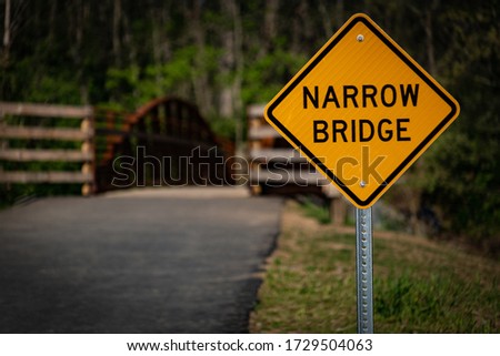 Narrow Bridge sign in a park trail