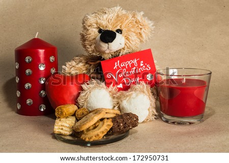 bear with a red heart and a postcard
