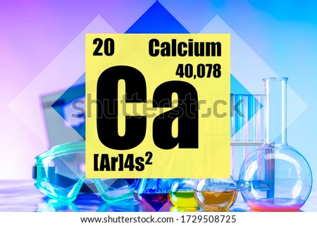 Calcium. The most important macronutrient in the human body, animals and plants. Skeleton and bones. Data on a chemical element with atomic number 20 against the background of a chemical laboratory. 