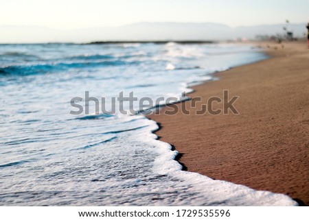 A picture of the waves rolling across the shoreline at Dockweiler State Beach.