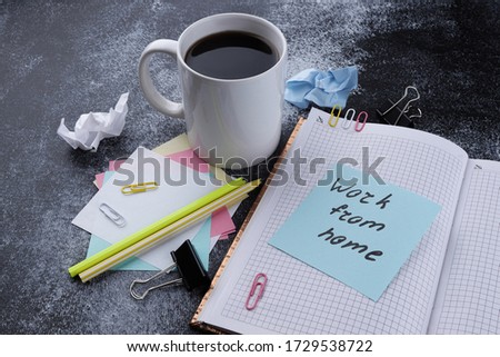 Text Work From Home on paper, a cup of coffee, notepad