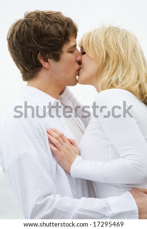 A shot of a caucasian couple in love kissing
