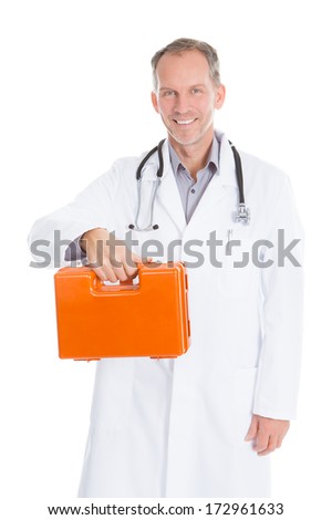 Portrait Of Mature Male Doctor Holding First Aid Box