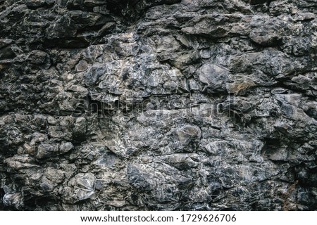 surface of the cave rock wall. gray stone texture background.