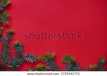 Christmas decorations layout or flatlay with fir branches and cones on red background.Eco natural frame. winter, new year Holidays concept as top view, copyspace. greeting card template Royalty-Free Stock Photo #1729641715