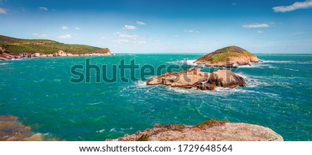 Sunny spring view of popular scenic spot - Isola di Campi, Apulia region, Italy, Europe. Stormy wether on Adriatic sea. Beauty of nature concept background.
