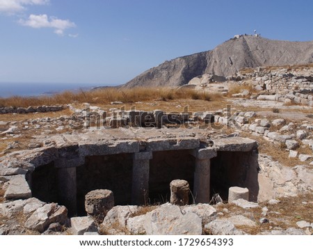 Ancient Thira (Thera) is an ancient city located on the steep rocky cape Mesa Vouno on Santorini island, Greece. The ruins of ancient buildings.