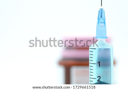 Syringe isolated on white background. Cure for Coronavirus COVID 19 virus disease. Research  vaccine illustration.