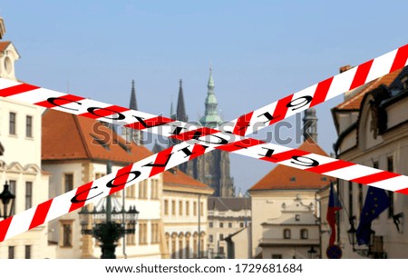 Coronavirus in Prague, Czech Republic. St. Vitus Cathedral (Roman Catholic cathedral ). Covid-19 sign on a blurred background. Concept of COVID pandemic and travel in Europe.