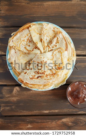 fresh crepes on wooden surface