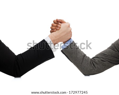 business and fight concept - businessman and businesswoman wretsling on table