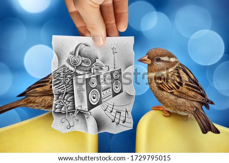 Mixed media image showing a hand-held piece of paper with a realistic pencil drawing on it depicting a bird holding an hi-fi system with music notes with another bird and bokeh in the photo background