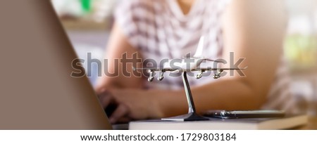 Woman check flight status on travel From an epidemic event Affecting businesses around the world, Investment, Stock market, Product business, Trading. Royalty-Free Stock Photo #1729803184