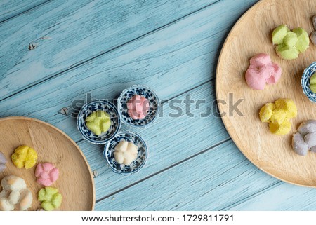 Thai Traditional Cookie on Old Ceramic Dish with Blue Wooden Background, Flat Lay Top View Angle