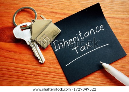 Inheritance Tax and key from inherited property. Royalty-Free Stock Photo #1729849522