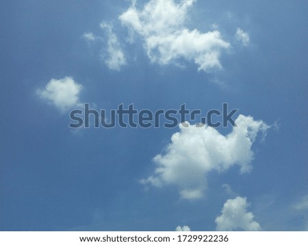 photo of a blue sky with beautiful white clouds
