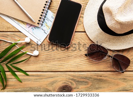 Summer holiday background, travel concept with camera on wooden table background. Flat lay