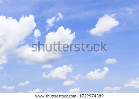 soft white clouds against blue sky background. 