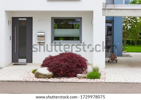 house entrance of new modern building in germany springtime Royalty-Free Stock Photo #1729978075