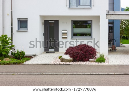 house entrance of new modern building in germany springtime Royalty-Free Stock Photo #1729978096
