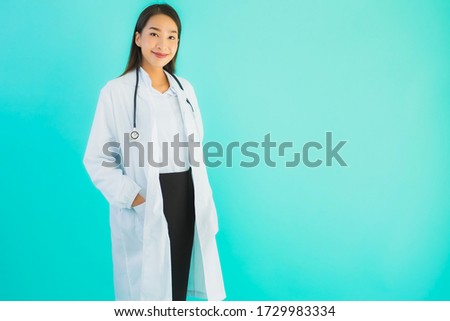 Portrait beautiful young asian doctor asian woman work at clinic or hospital on blue isolated background