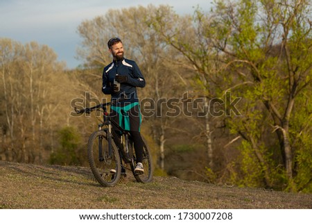 cyclist rides through the woods