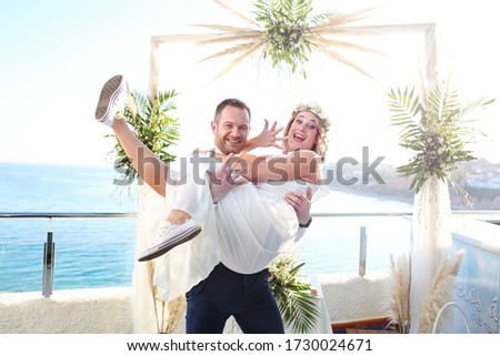 Romantic intimate beach wedding. A couple during a beach wedding ceremony.