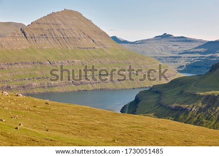 Faroese islands landscape with green mountains and fjord. Travel Faroe