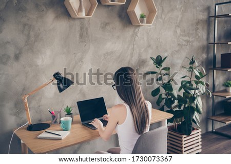 Back rear spine view photo of focused successful smart expert chief manager work remote laptop read collars report prepare start-up coaching conference sit table chair in house indoors