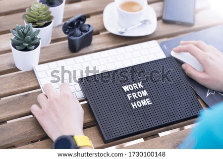 Work from home concept due to quarantine with computer keyboard and coffee cup 