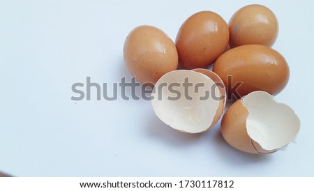 Brown chicken eggs isolated on white background.
