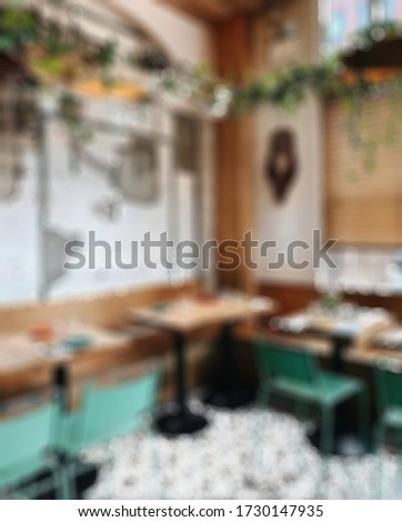 A blurry decoration restaurant and cafe soft and blur with bokeh lights .