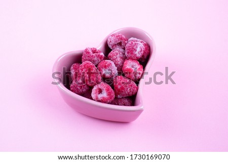 Raspberries on a pink background. Concept Valentines day, Mothers day. 