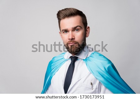 Super hero doctor. Portrait of nurse wearing hero cape