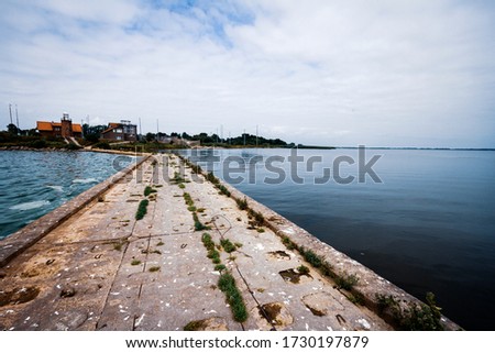 Vente Cape in Lithuania. View of a pier in the sea.