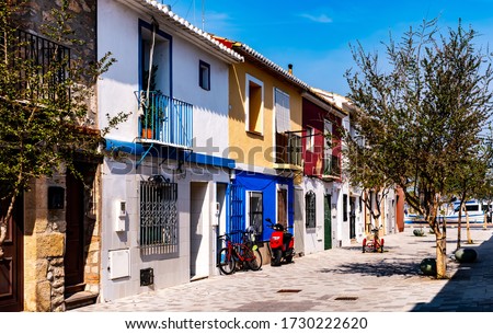 View of colorful homes near the ocean in picturesque town of Denia in southern Spain. Royalty-Free Stock Photo #1730222620