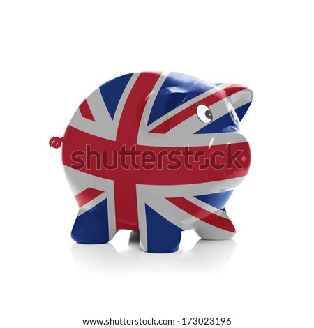 Piggy bank with flag painting over it isolated on white - United Kingdom