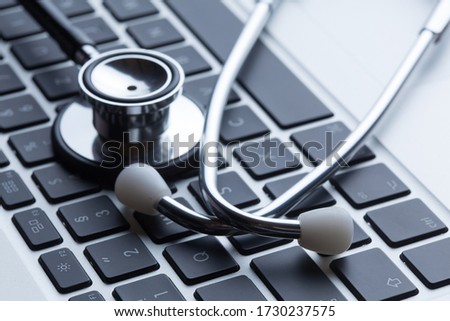 Stethoscope lies on laptop keyboard