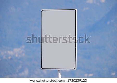 Closeup blank billboard sign with background of mountain landscape