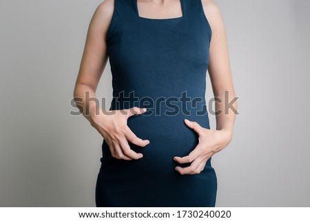 Itching of pregnant women on a white background / Healthcare and medical concepts Royalty-Free Stock Photo #1730240020