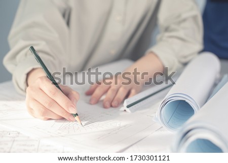 Construction and structure concept of Engineer or architect meeting for project working with partner and engineering tools on fake blueprint for stock photo, contract for both companies. 