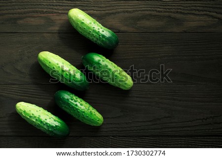 Cucumbers on a wooden background. Selective focus